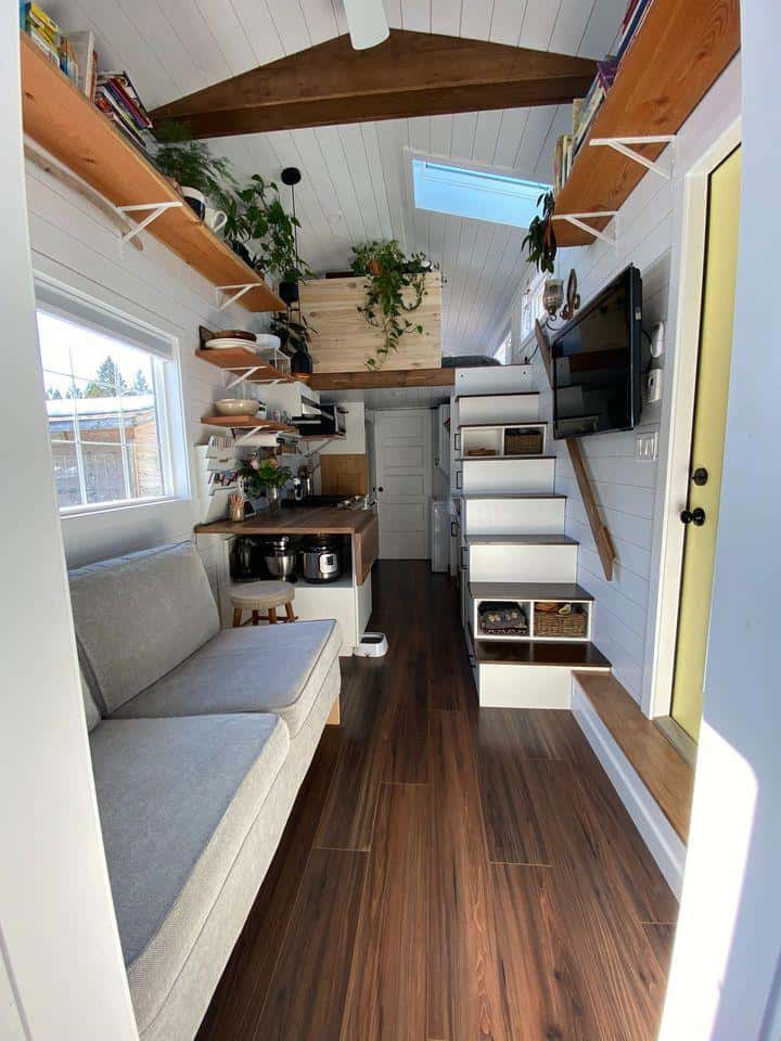 Tiny House Interior with Loft and Smart Storage Solutions.