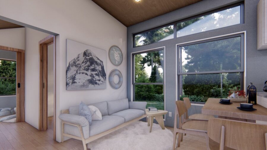 Bright and airy tiny house interior with large windows and modern decor.