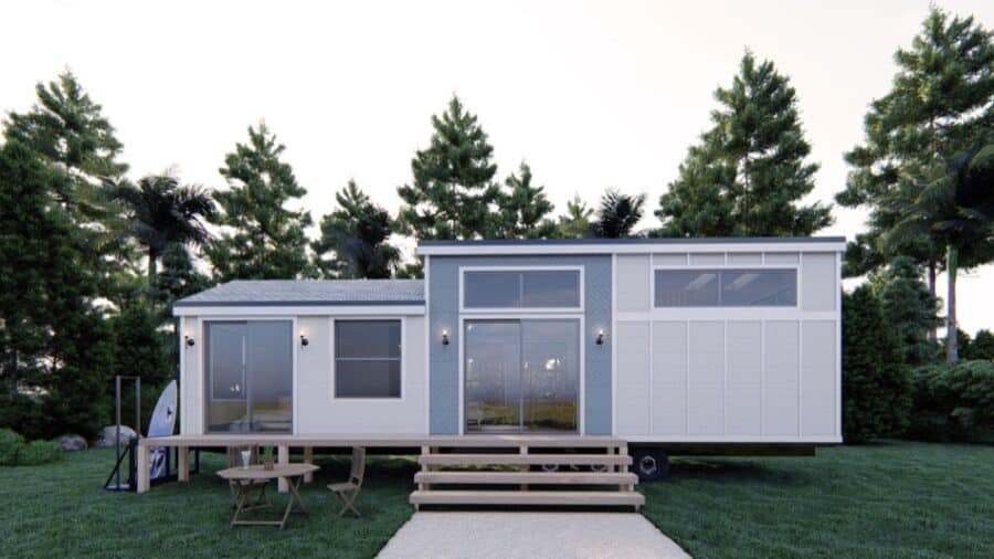 Portable tiny house with modern design and large windows on a trailer.