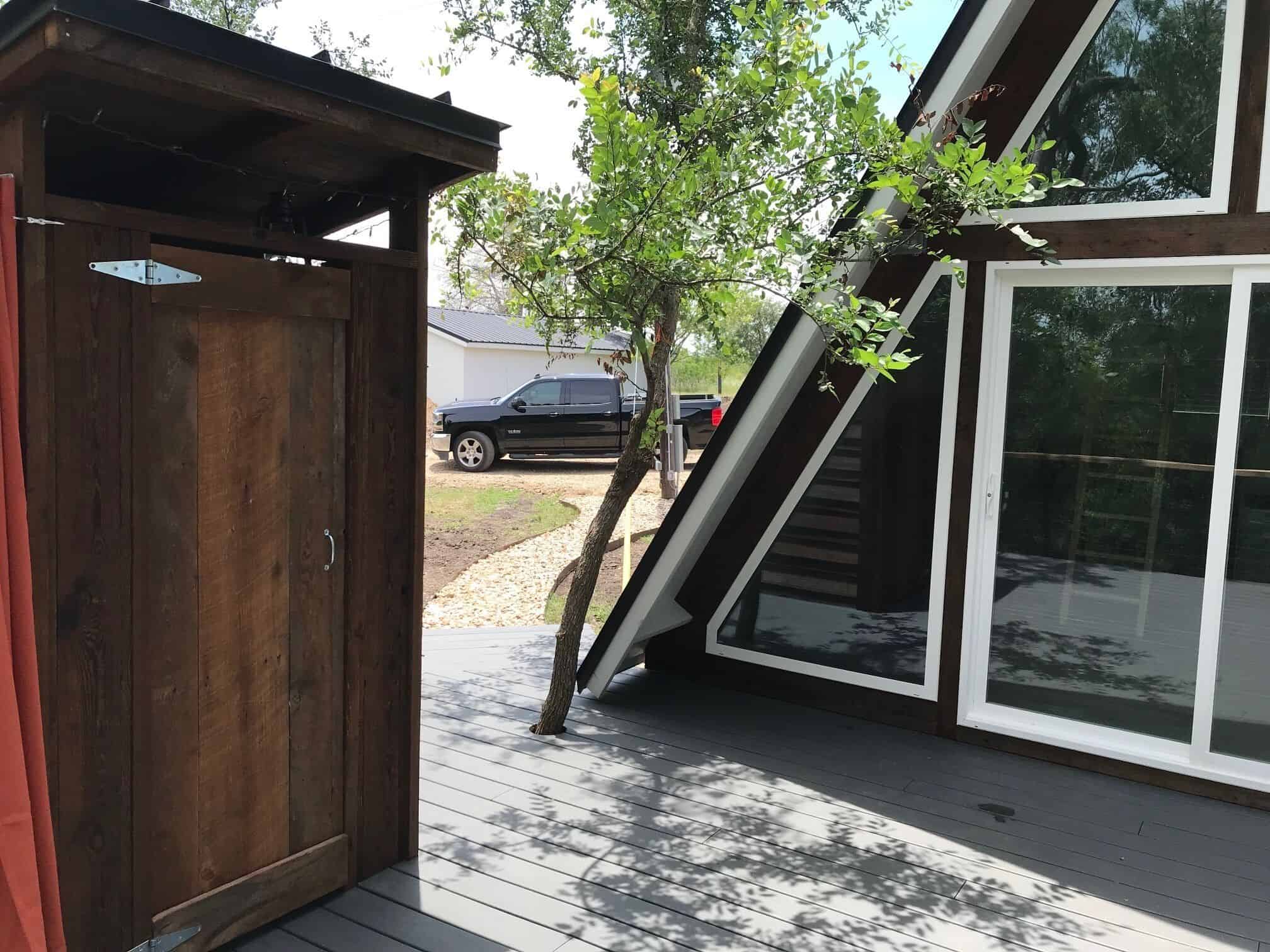Outdoor shower stall next to the A-frame cabin on the deck at Spencer Ranch