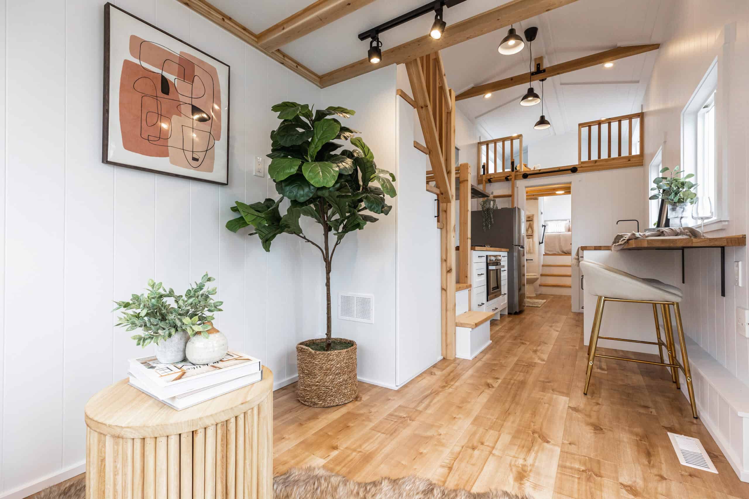 Bright tiny house interior featuring natural wood accents and minimalist design.
