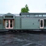 Cascade Max park model tiny home by Tru Form Tiny with Pewter Green siding and charcoal standing-seam metal roof