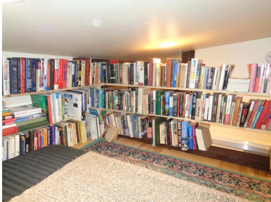 Compact tiny house bookshelf with a large collection of books for small space living.
