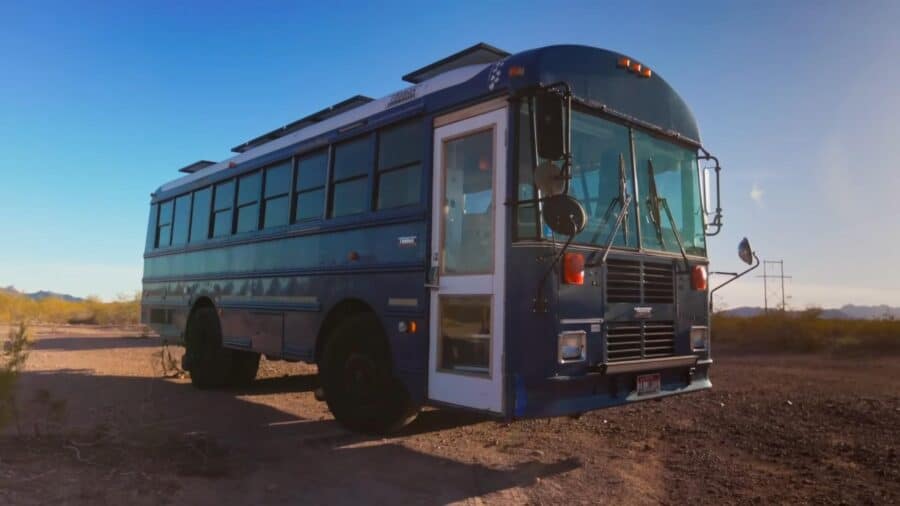 Custom school bus conversion showcasing tiny living space and mobility.