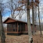 Cozy tiny house surrounded by trees in Wisconsin Northwoods.