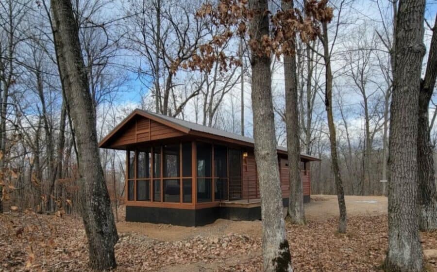 Cozy tiny house surrounded by trees in Wisconsin Northwoods.