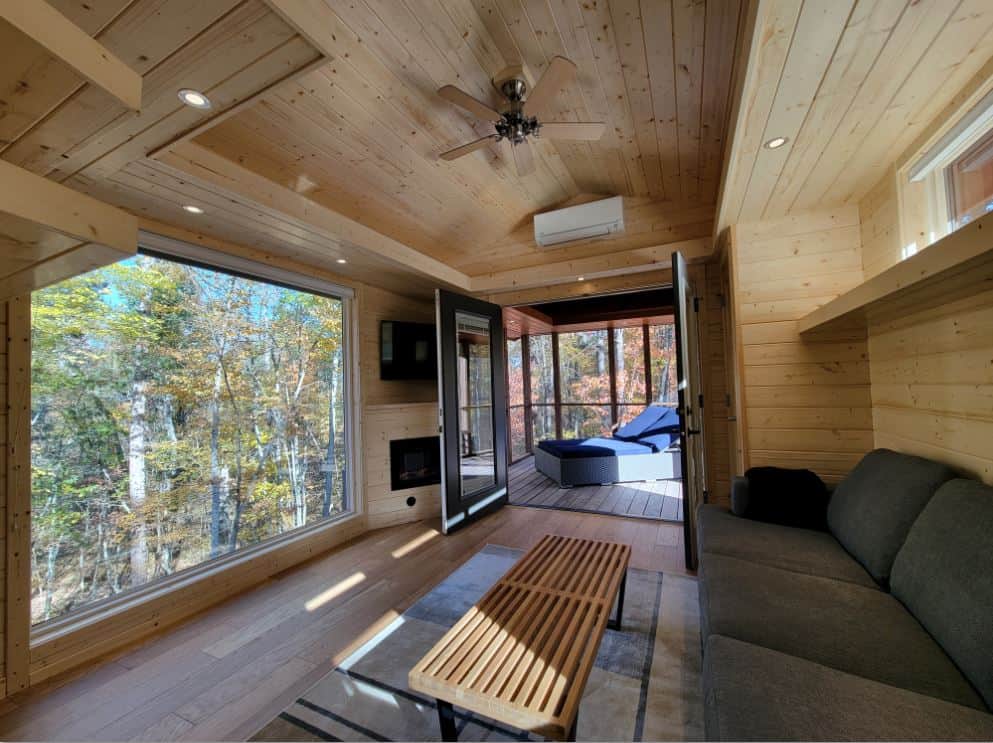 Tiny House Interior with Large Windows and Wooden Finish