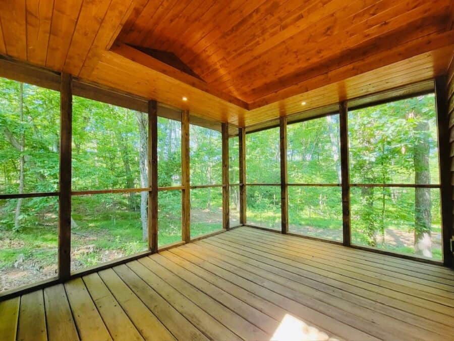 Tiny House screened porch with lush forest views.
