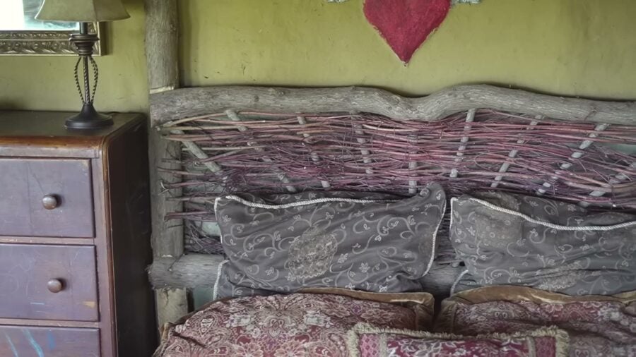 Woven wattle headboard in the wattle-and-daub bedroom