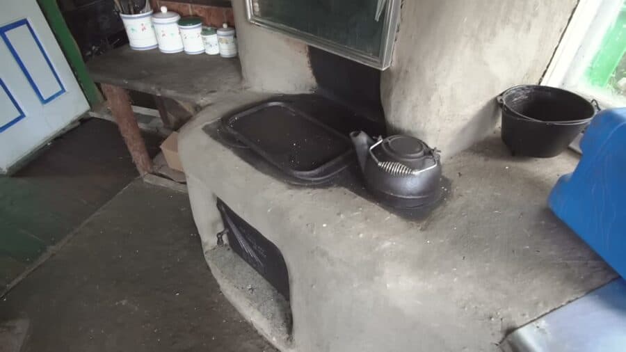 Handmade cob cookstove with oven and smoker box in the west wing kitchen