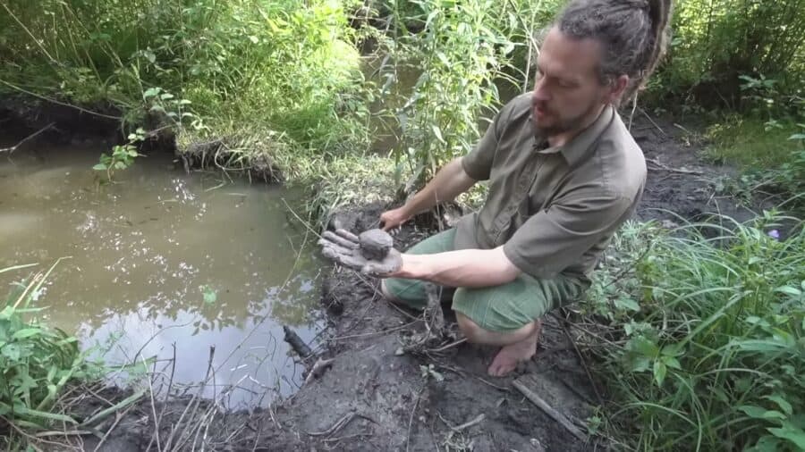 Bryce testing clay dug from the wetland on their Ontario homestead