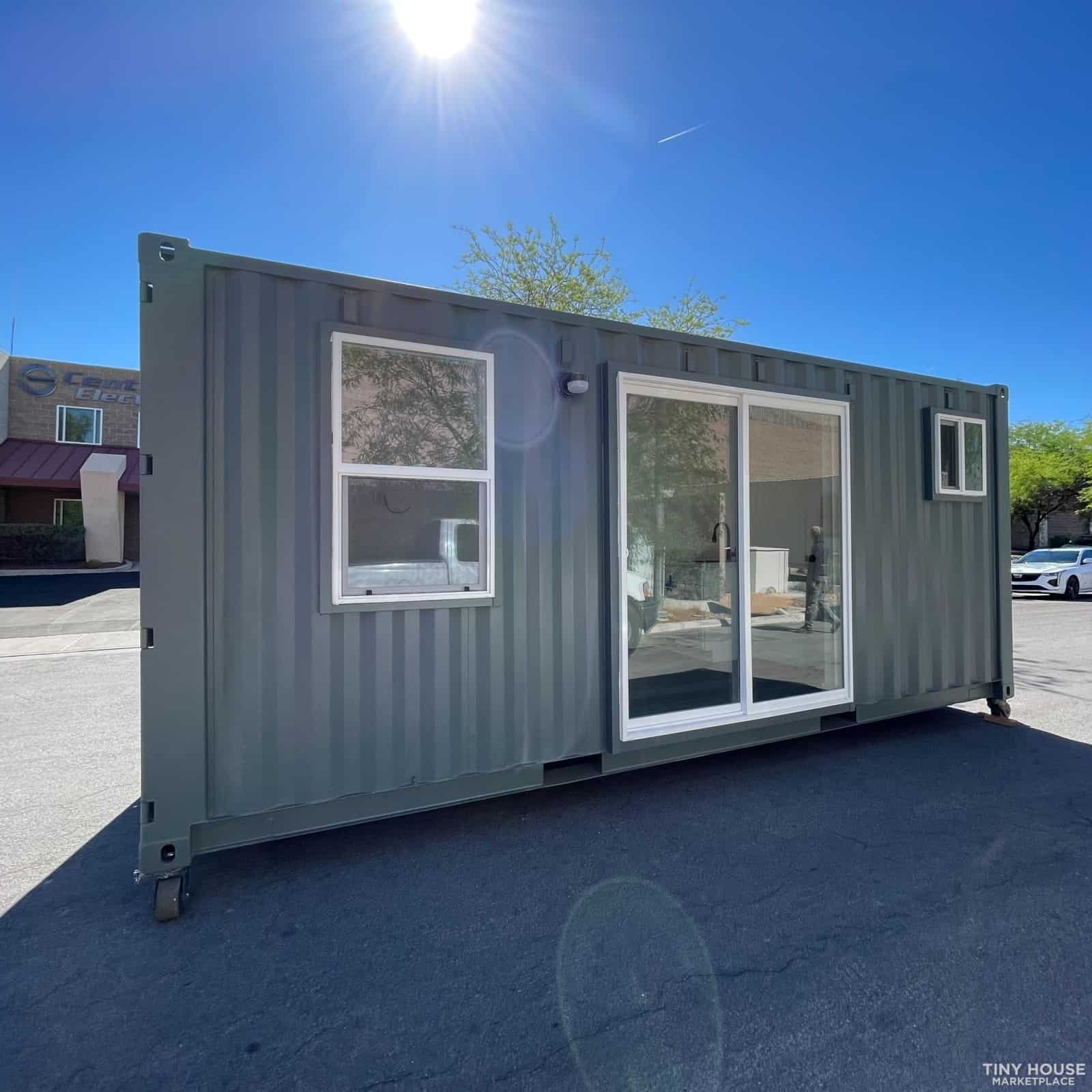 Container Tiny House with Large Windows and Sliding Door.
