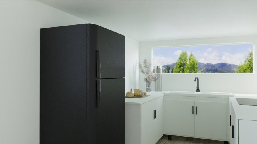 Modern tiny house kitchen with sleek black appliances and bright natural light.