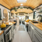Couple & Their Dogs Convert a 40 Ft Skoolie with Wood Stove