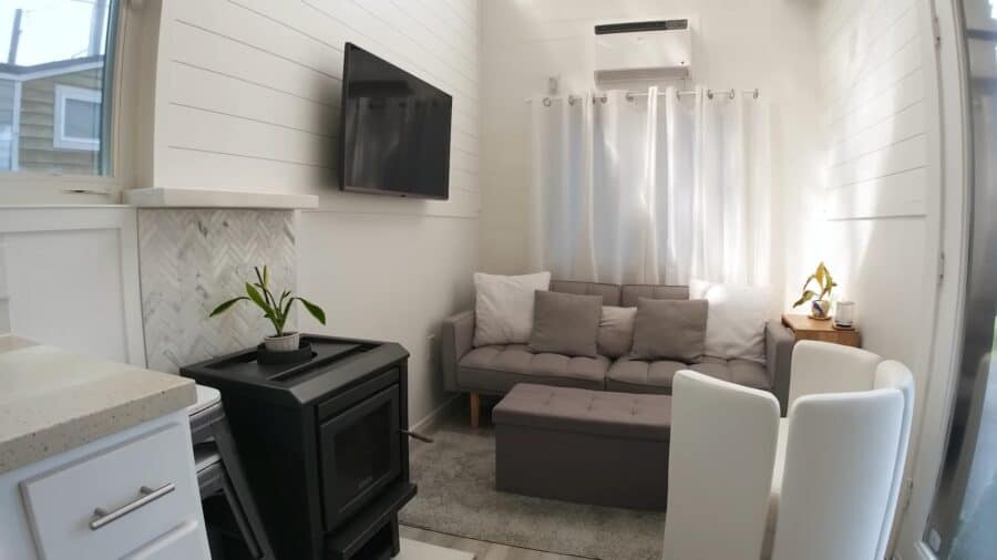 Bright tiny home living room with large skylight and modern furnishings.