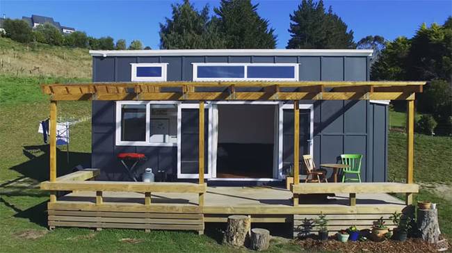 Exterior view of the climbing wall tiny house on wheels