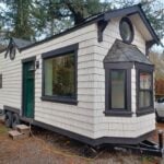 Craftsman tiny house featuring a Japanese-inspired soaking tub and modern design elements.
