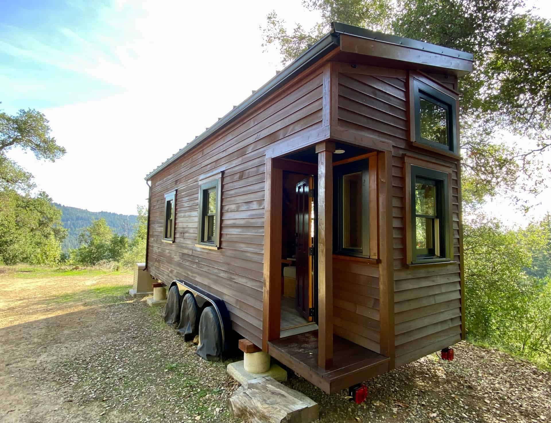 Custom 24ft tiny house on wheels for sale in Los Gatos California with cedar siding and covered porch