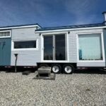 Elegant tiny house built by a skilled cabinet maker, showcasing custom craftsmanship and efficient s.