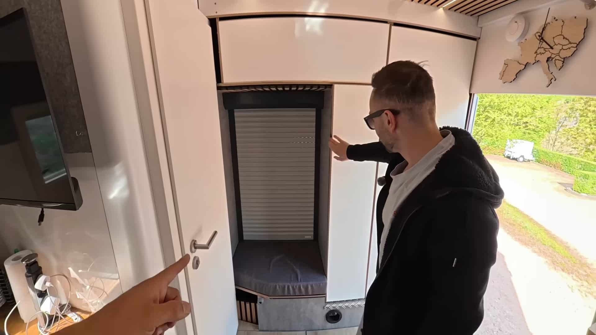 Roller shutter door closed between cab and living area with insulating foam panel