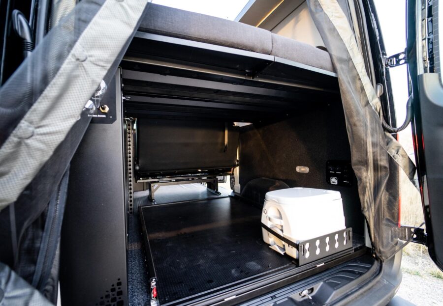 Custom van conversion with organized storage for family adventures.