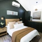 Cozy tiny house bedroom featuring two first-floor bedrooms and a spacious loft for versatile living.