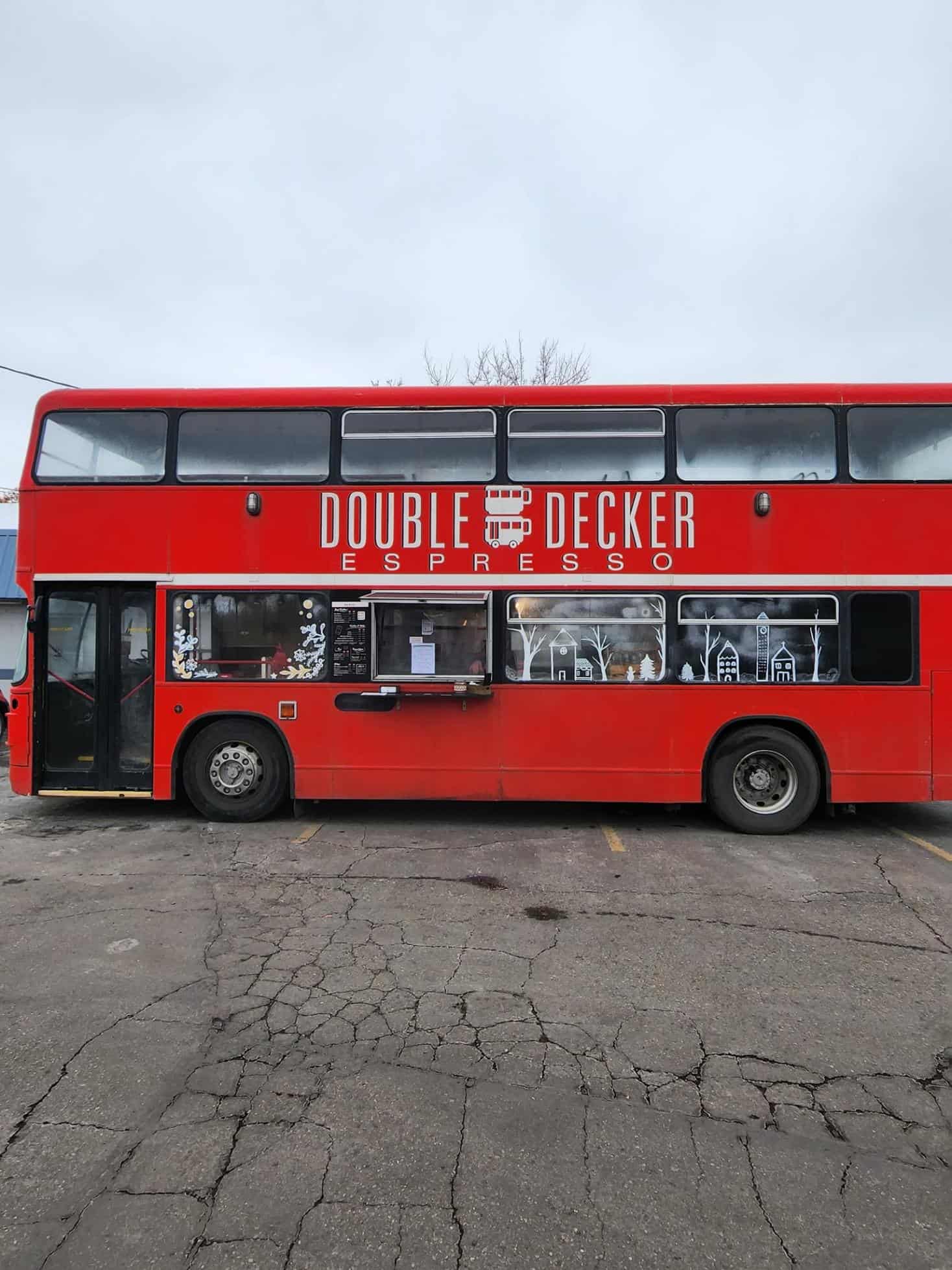 Red double decker bus converted into a cozy coffee shop and Airbnb rental.