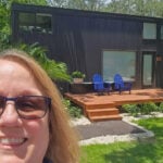 Modern tiny house with outdoor deck and seating in Tampa Tiny Village.