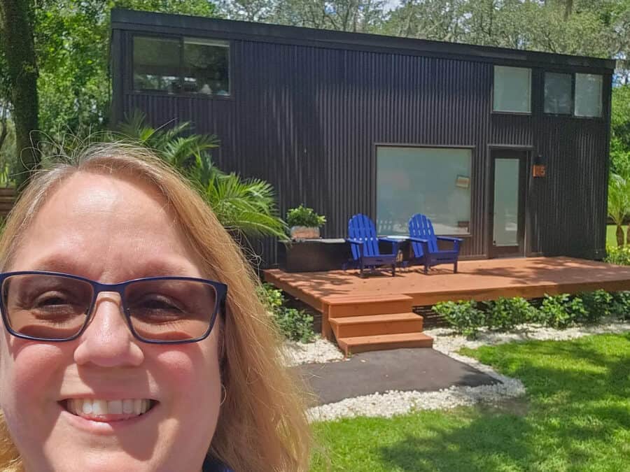 Modern tiny house with outdoor deck and seating in Tampa Tiny Village.