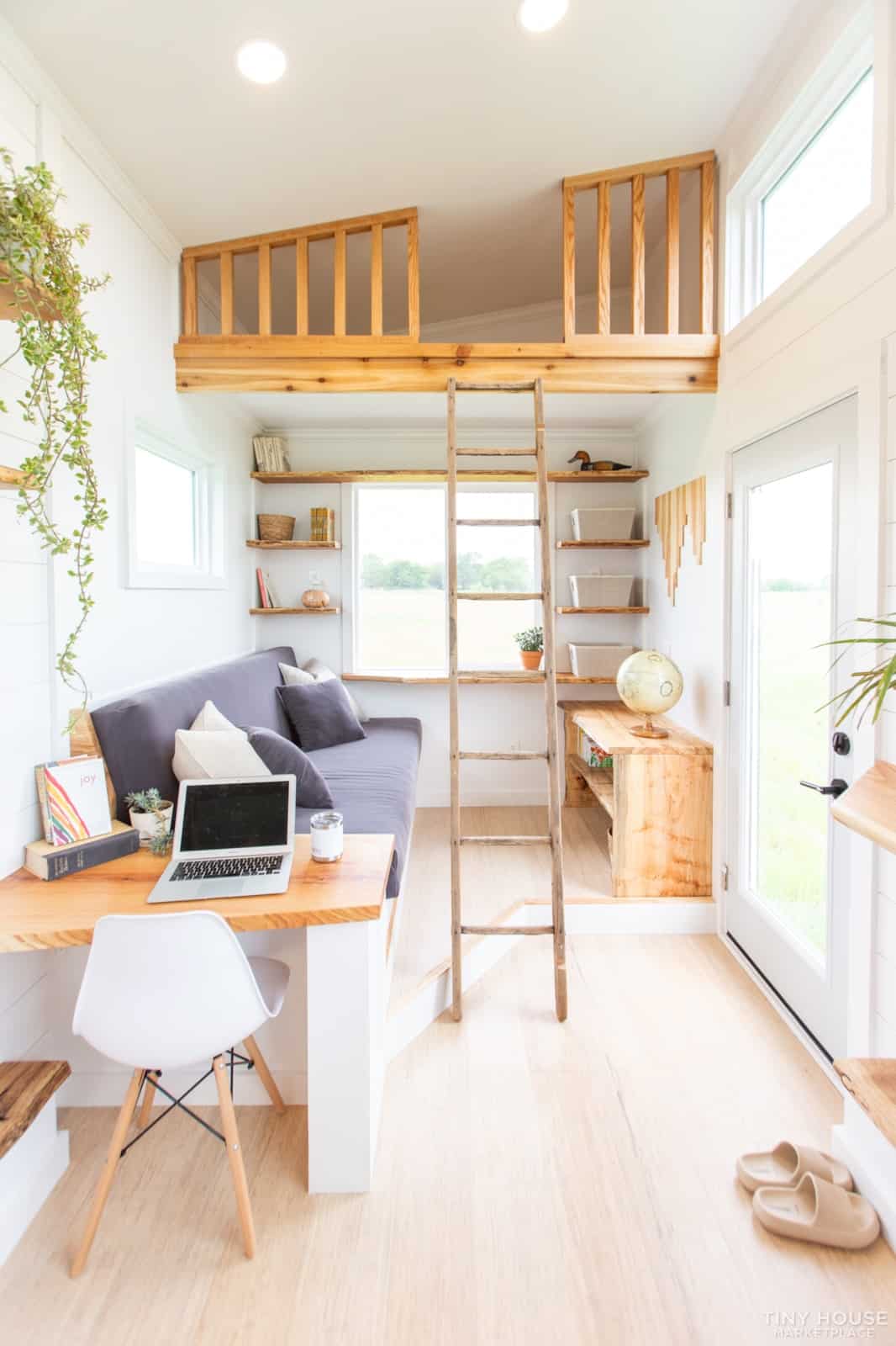 Restored vintage ladder leading to the Elderberry's secondary storage loft above the living room and desk