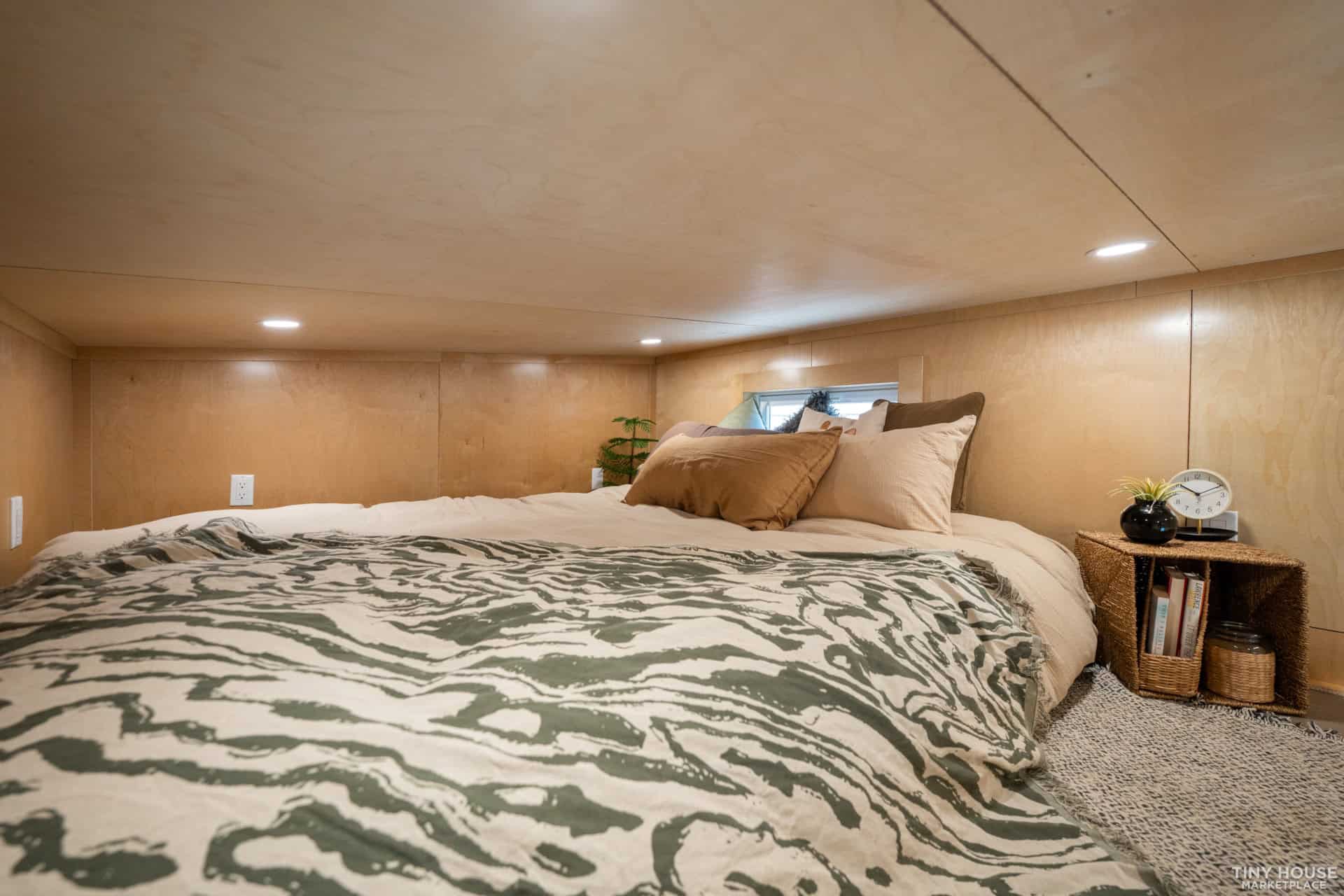 Element 16 Pro sleeping loft with queen bed, recessed lighting, and birch plywood walls