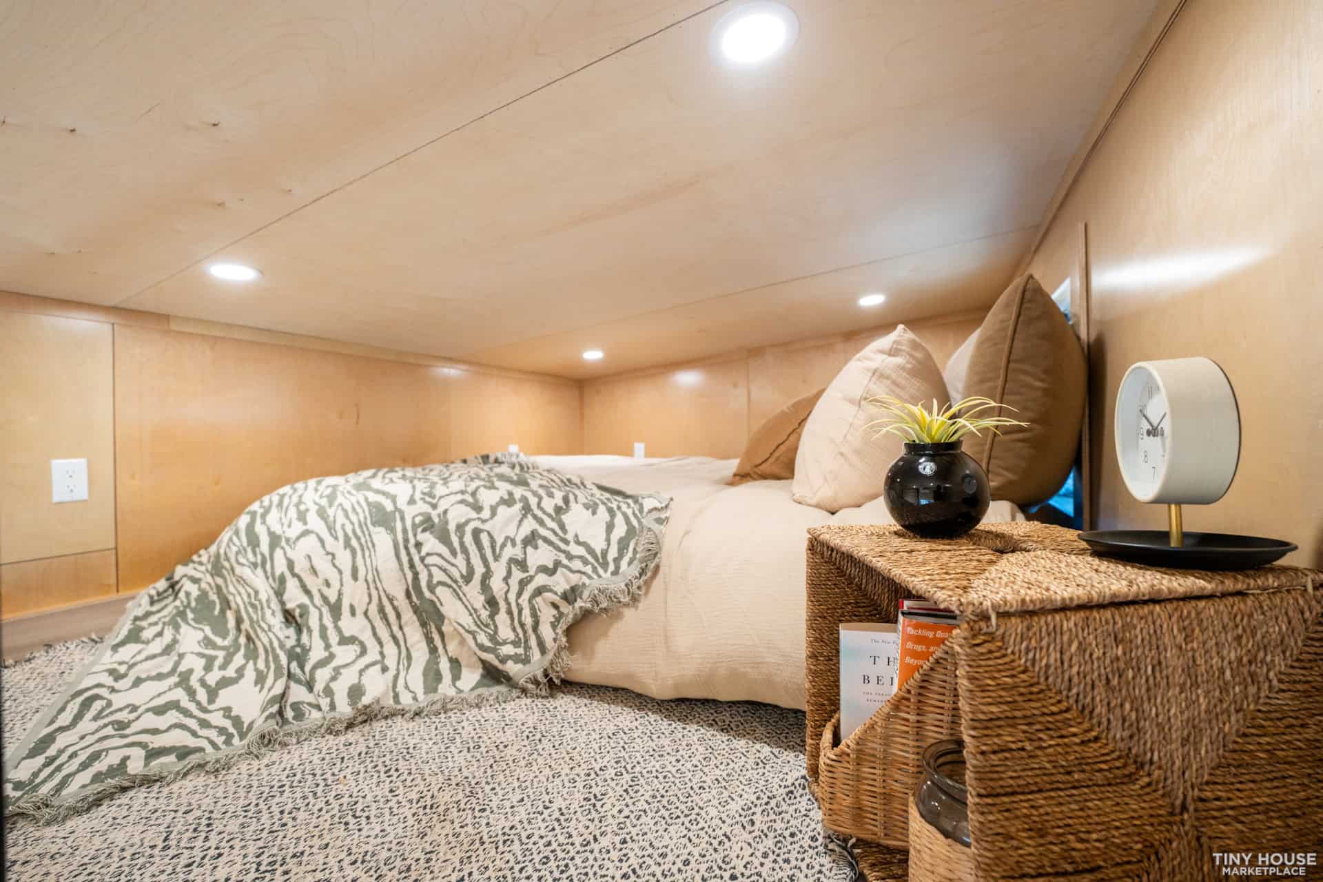 Element 16 Pro loft bedroom closeup with wicker nightstand and bedding
