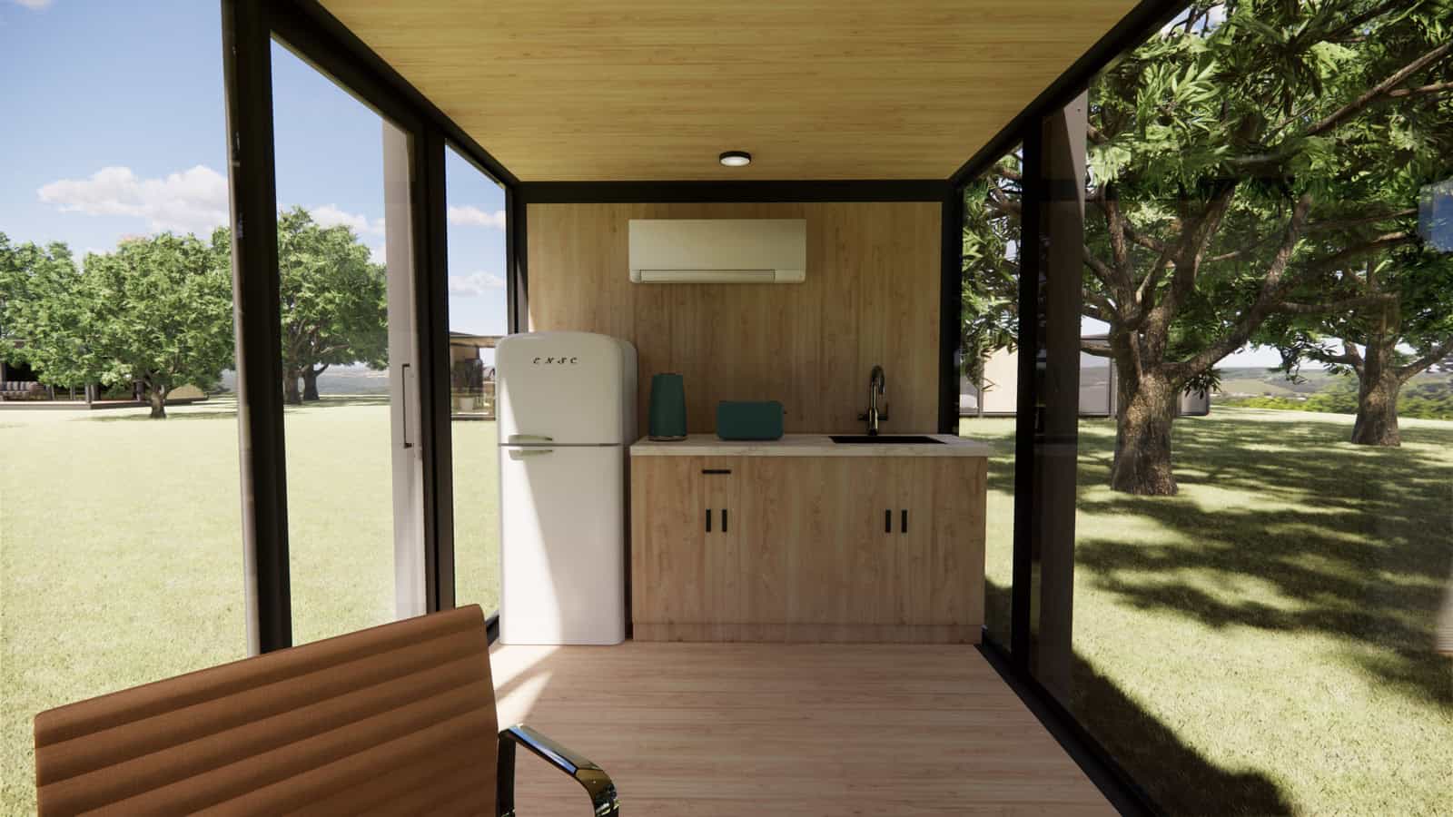 Timber kitchenette with solid benchtop, undermount sink, full-height fridge, and wall-mounted air conditioner