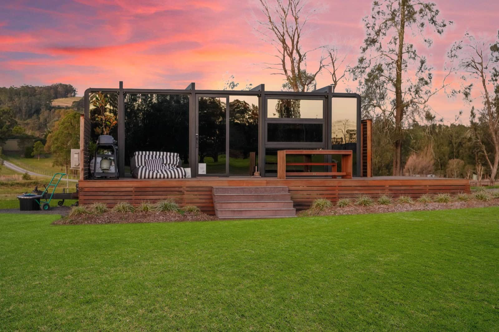 The Berry 8m pod at sunset with pink sky over the New South Wales South Coast escarpment