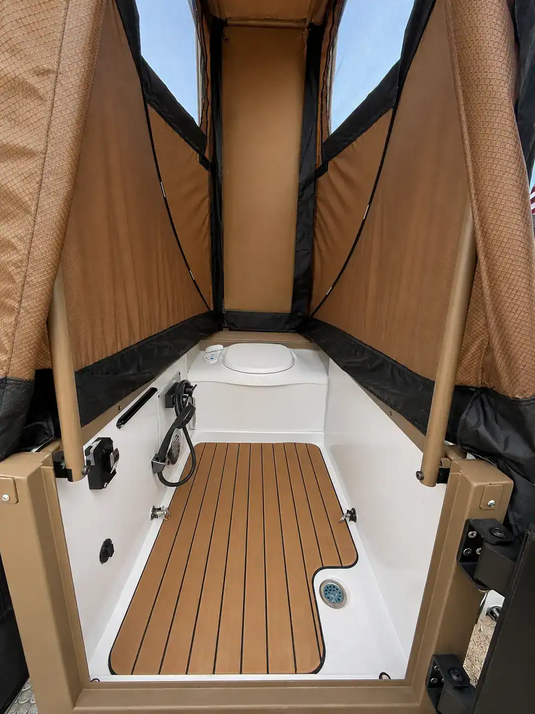 Inside the Encore RV ROG 12RK-FB stand-up bathroom module showing the slip-resistant EVA floor and toilet
