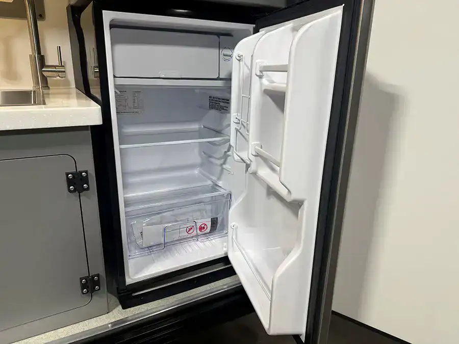 The 3.3 cubic foot 12V refrigerator in the Encore RV ROG 12RK-FB