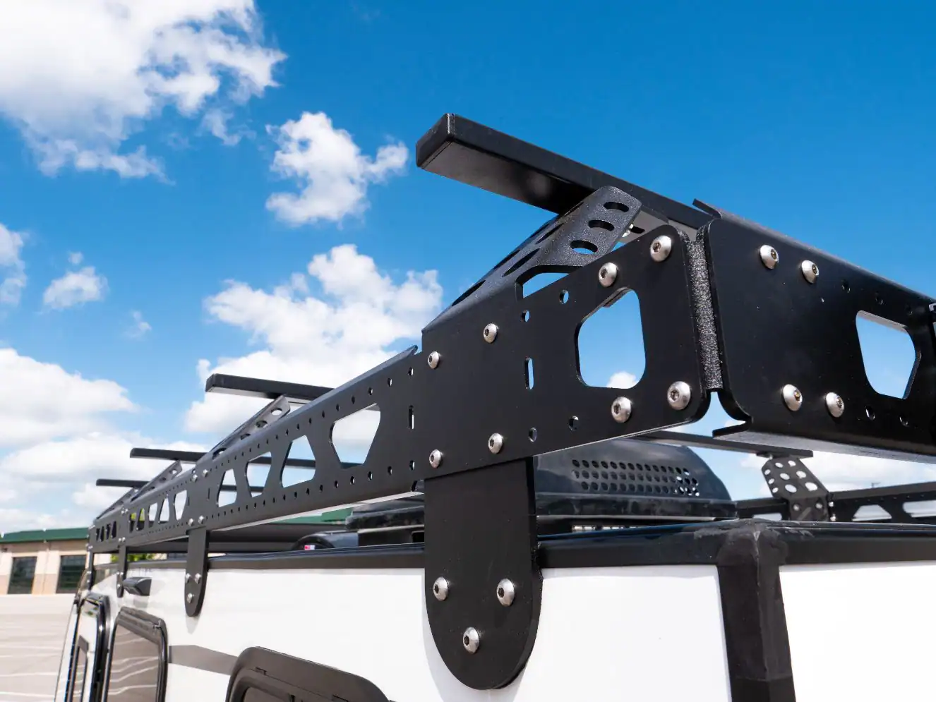 The roof rack system on top of the Encore RV ROG 12RK-FB for carrying gear and solar
