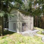 Tiny House in Forest Setting with modern design and eco-friendly features.