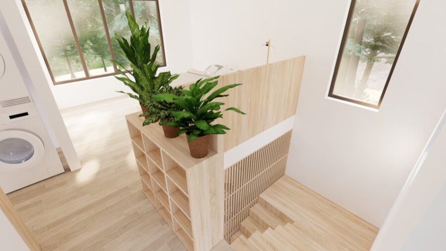 Bright interior of the Bosun Cabin tiny home with natural wood finishes and greenery.