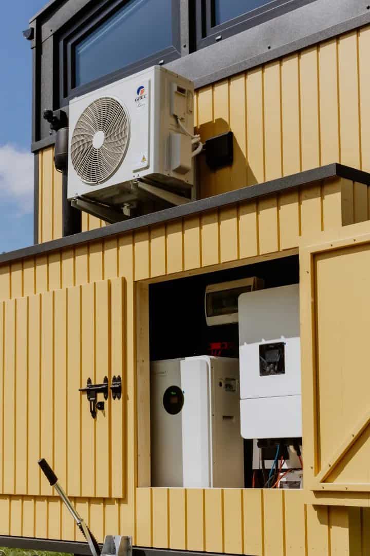 An exterior hatch on the Erica revealing the solar inverter and battery system