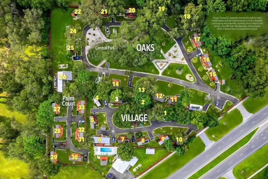 Aerial site map of ESCAPE Tampa Bay showing The Village, The Oaks, Palm Court, Central Park, numbered lots, and onsite storage.