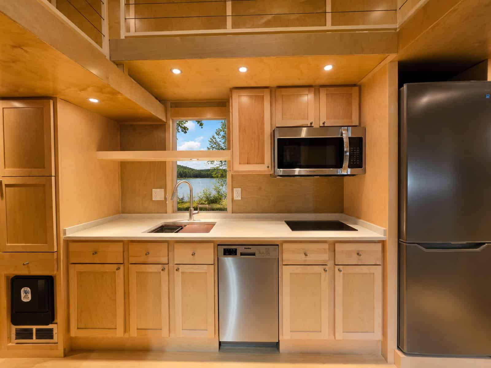 All-electric kitchen in the Escape eONE Limited Edition with quartz counters, dishwasher and induction cooktop