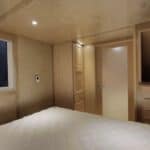 Bright interior of ESCAPE eONE tiny house with main-floor bedroom and loft space.
