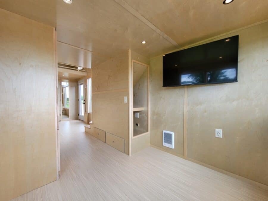 Compact tiny house interior with modern design and minimal decor.