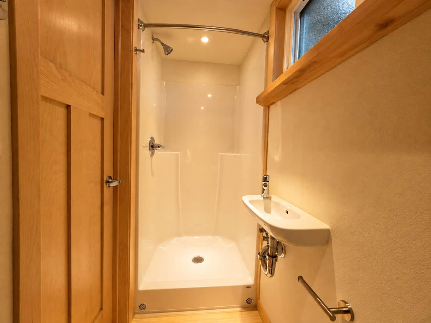 Full-size shower stall in the eVista XL Limited tiny house bathroom