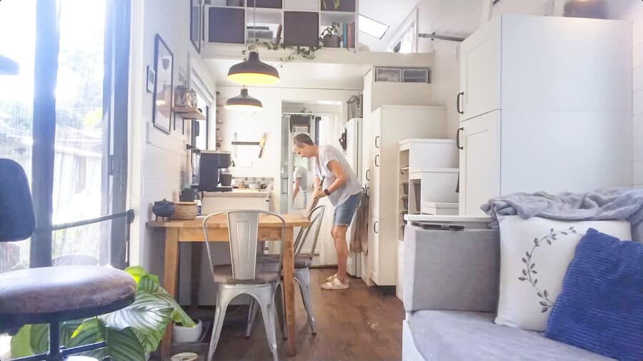 Bright tiny house interior with compact kitchen and cozy living space in Australia.