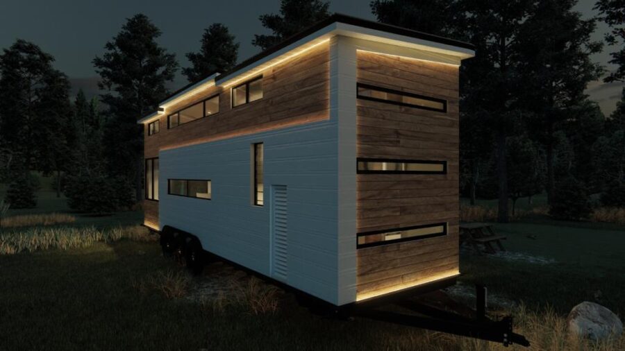 Modern tiny house with sleek design and expansive windows in a wooded setting.