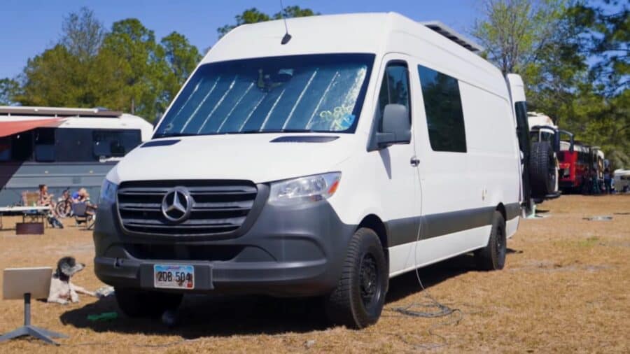 Off-grid family adventure van with bunk beds for sustainable travel.