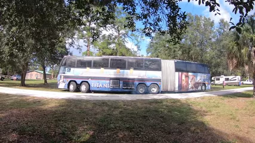 Family of 8 in huge converted bendy tour bus via Carey On Vagabond YouTube 001