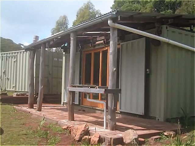 Family turns used shipping containers into tiny home and workshop via ozcontainerhouse 0014